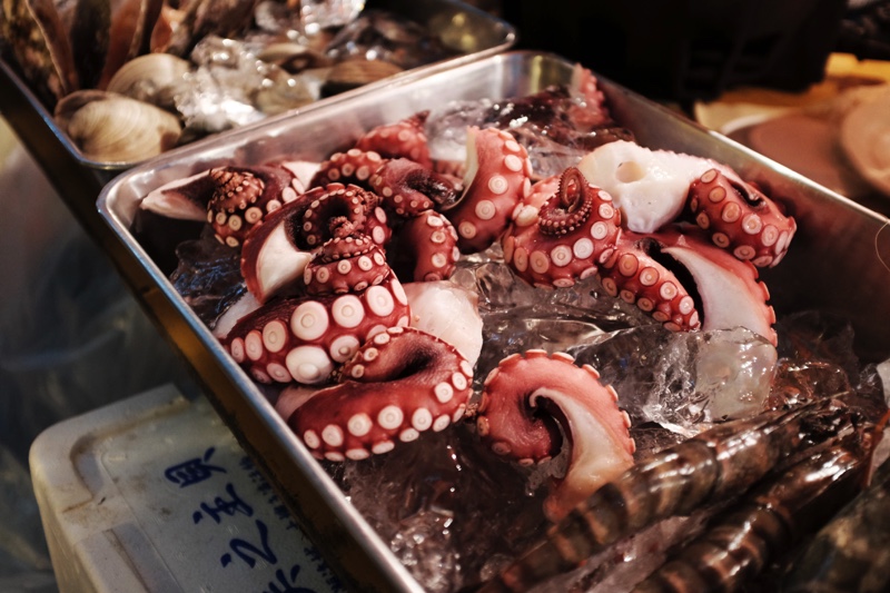 A tray of squid at a seafood market in Japan.