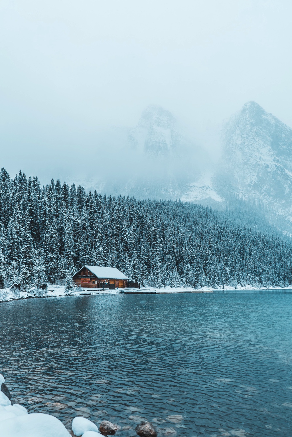 A cabin in the snow, at the side of Lake Louise, Canada.