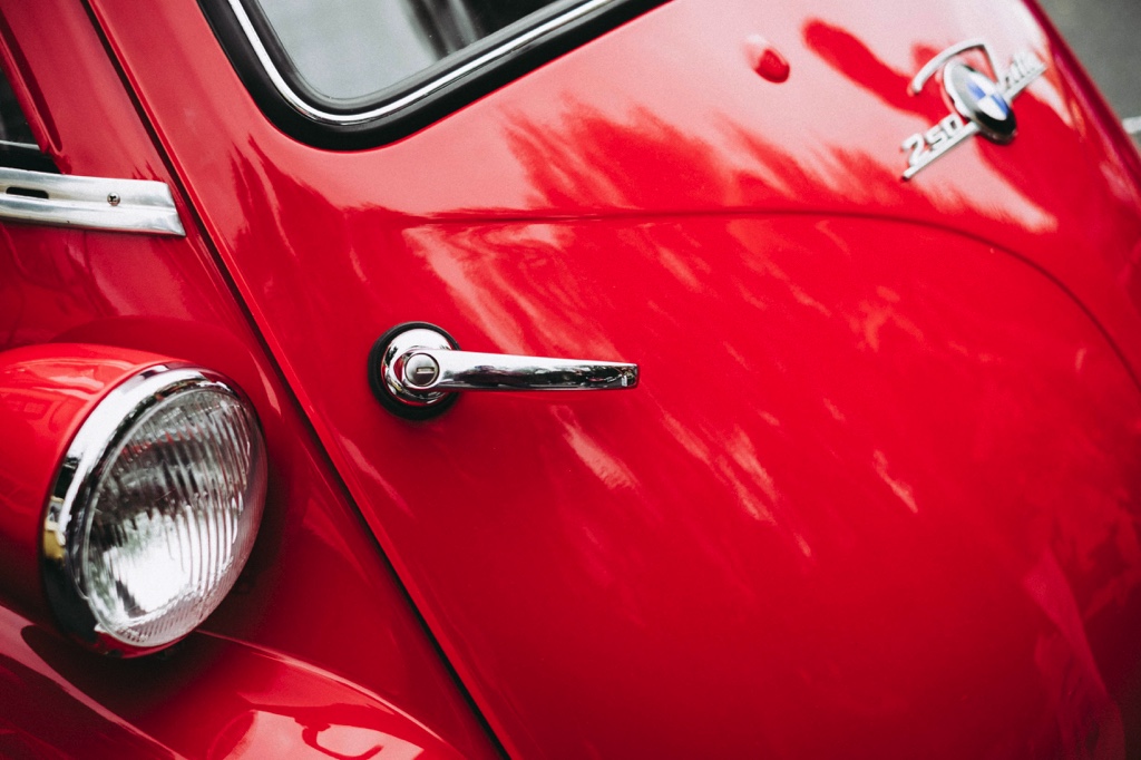 Close-up of a red vintage BMW car.